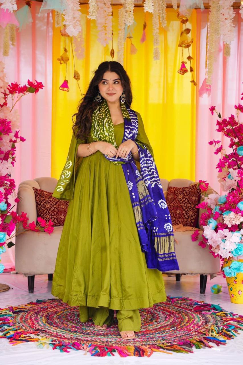 Green  suit set with exqui complemented by a beautifully printed dupatta.