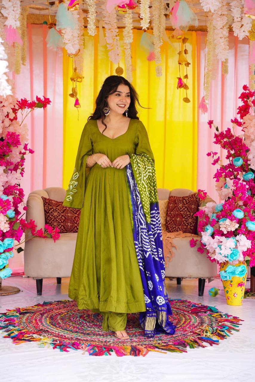 Green  suit set with exqui complemented by a beautifully printed dupatta.