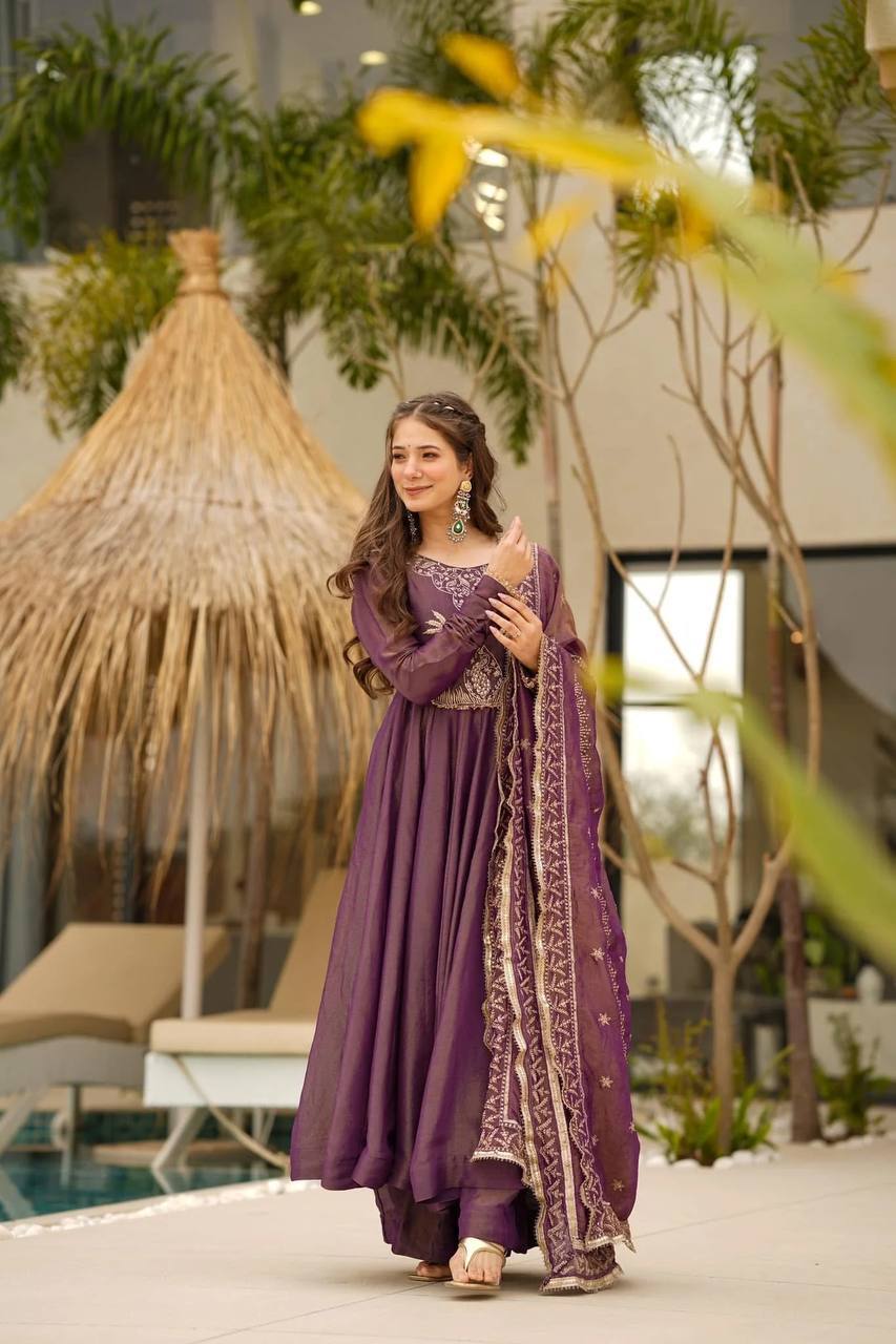 Shimmer Febric featuring intricate embroidery on kurta.